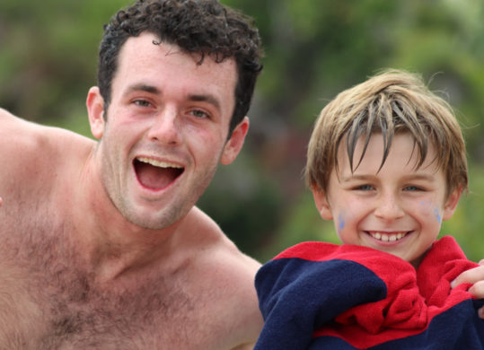 camper and counselor smiling after swimming