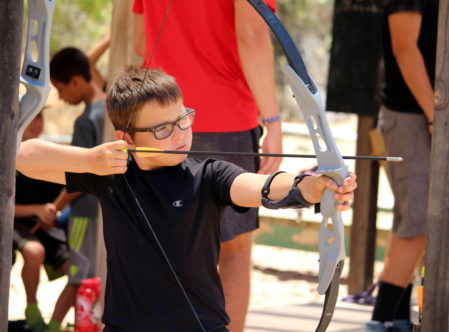 boy doing archery