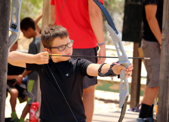 boy doing archery