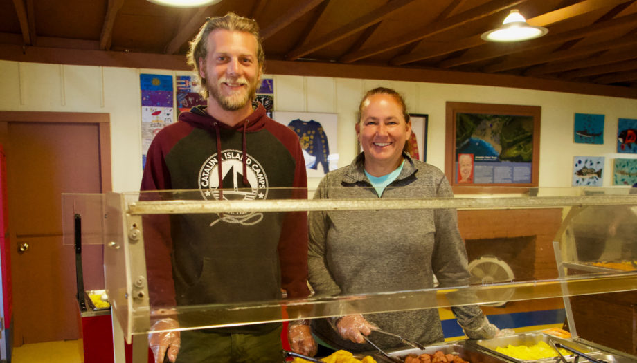 Kevin and Maria serving dinner