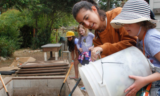 working on the camp compost